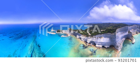 Ionian islands of Greece. beautiful Corfu. Panoramic aerial view of stunning Cape Drastis - natural beauty landscape with white rocks and turquoise waters, northern part of  island. 93201701