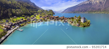 Stunning idyllic nature scenery of lake Brienz with turquoise waters. Switzerland, iseltwald village, Bern canton. village surrounded turquoise waters ,aereal view 93201714