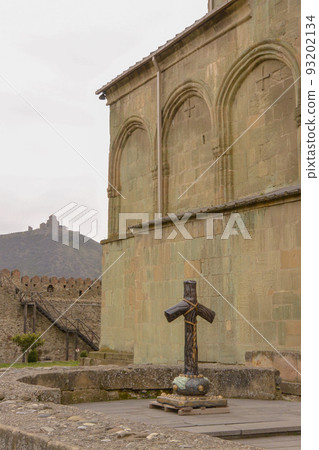 Georgian Grape Cross and Jvari Monastery on the hill beyond Georgian Grape Cross and Jvari Monastery on the hill beyond 93202134