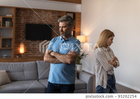Despaired sad mature caucasian male with beard ignores offended female after conflict, back to back 93202254