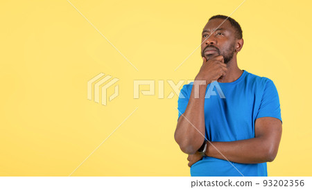 African American Man Thinking Looking Aside Over Yellow Background, Panorama African American Man Thinking Looking Aside Over Yellow Background, Panorama 93202356