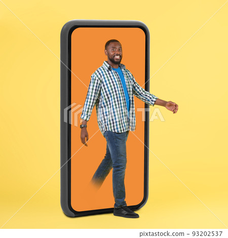 Black Guy Stepping Out Of Huge Smartphone Screen, Yellow Background Black Guy Stepping Out Of Huge Smartphone Screen, Yellow Background 93202537