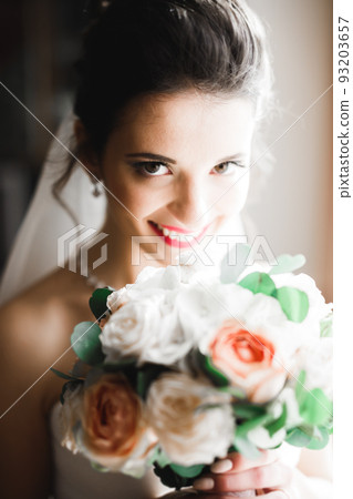 Beautiful fashion bride in wedding dress posing Beautiful fashion bride in wedding dress posing 93203657