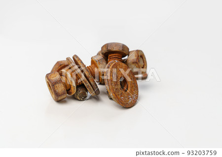 Rusty metal bolts and screws on a white background.  93203759