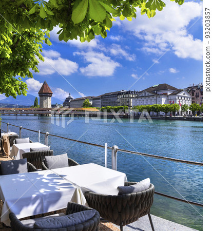 Most beautiful and romantic town and tourist destination in Switzerland -  Luzerne. Restaurant by riverside 93203857