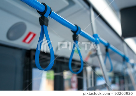 View from inside the city bus with passengers. View from inside the city bus with passengers. 93203920