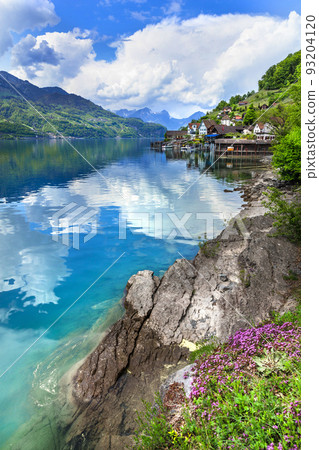Idyllic nature of Swiss lakes - Walensee ,tranquil typical small village Quinten. Switzerland scenic landscape Idyllic nature of Swiss lakes - Walensee ,tranquil typical small village Quinten. Switzerland scenic landscape 93204120