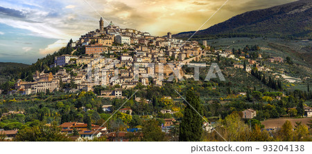 Traditional scenic countryside of Italy and famous medieval hilltop villages of Umbria - Trevi town over sunset, Perugia province 93204138