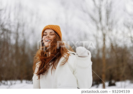 cheerful woman red hair walk in the fresh winter air winter holidays cheerful woman red hair walk in the fresh winter air winter holidays 93204539