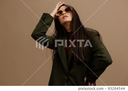 woman in a stylish suit in black glasses posing isolated background woman in a stylish suit in black glasses posing isolated background 93204544