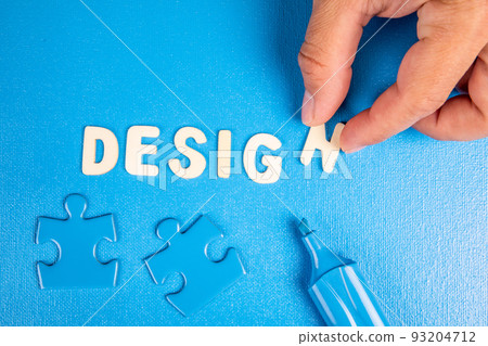 Design. Text from white wooden letters on a blue background Design. Text from white wooden letters on a blue background 93204712