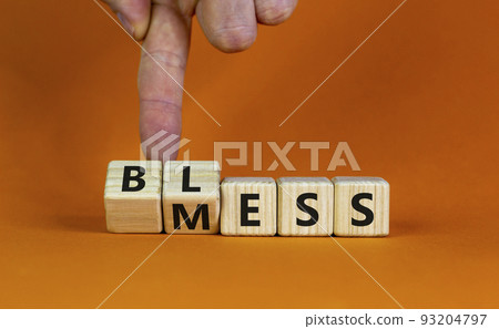 Bless mess symbol. Businessman turns the cube and changes the word 'mess' to 'bless'. Beautiful orange table, orange background, copy space. Business and bless mess concept. Bless mess symbol. Businessman turns the cube and changes the word 'mess' to 'bless'. Beautiful orange table, orange background, copy space. Business and bless mess concept. 93204797