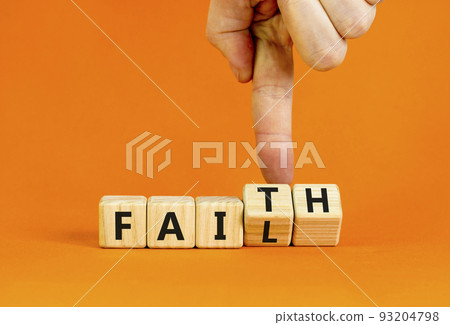 Faith instead fail symbol. Businessman turns wooden cubes and changes the concept word Fail to Faith. Beautiful orange table orange background. Business and faith instead fail concept. Copy space. Faith instead fail symbol. Businessman turns wooden cubes and changes the concept word Fail to Faith. Beautiful orange table orange background. Business and faith instead fail concept. Copy space. 93204798