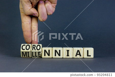 Millennial or coronnial symbol. Doctor turns wooden cubes and changes the concept word Millennial to Coronnial. Beautiful grey table grey background. Millennial or coronnial concept. Copy space. Millennial or coronnial symbol. Doctor turns wooden cubes and changes the concept word Millennial to Coronnial. Beautiful grey table grey background. Millennial or coronnial concept. Copy space. 93204811