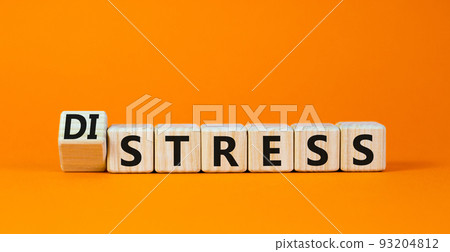Distress or stress symbol. Turned the wooden cube and changed the concept word Distress to Stress. Beautiful orange table orange background, copy space. Psychlogical and stress or distress concept. Distress or stress symbol. Turned the wooden cube and changed the concept word Distress to Stress. Beautiful orange table orange background, copy space. Psychlogical and stress or distress concept. 93204812