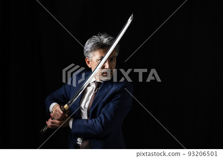 A man with a Japanese sword Black background A man with a Japanese sword Black background 93206501