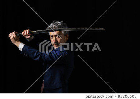 A man with a Japanese sword Black background A man with a Japanese sword Black background 93206505