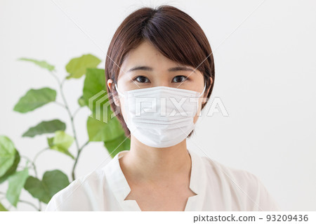 A woman wearing a mask 93209436