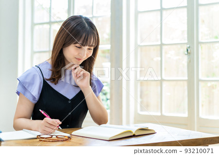 A young woman studying 93210071