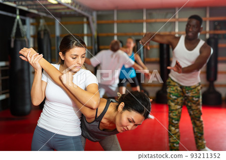 Womens sparring in self defense courses in gym 93211352
