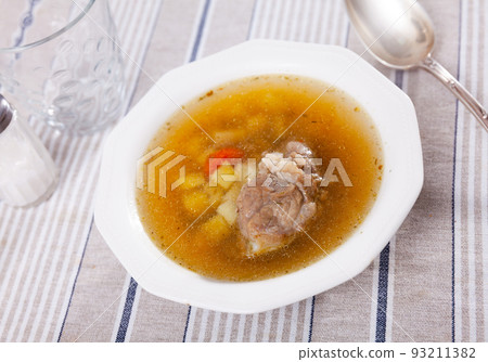 Light vegetable soup with slices of pork Light vegetable soup with slices of pork 93211382