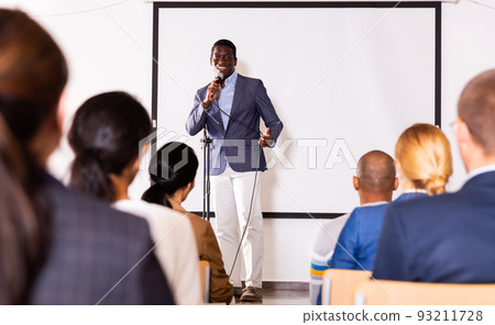 Young emotional male coach giving motivational speech Young emotional male coach giving motivational speech 93211728