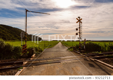 Scenery of Hongo railroad crossing and rice terraces on the San'in Main Line, Toyoura-cho, Shimonoseki City, Yamaguchi Prefecture 93212713