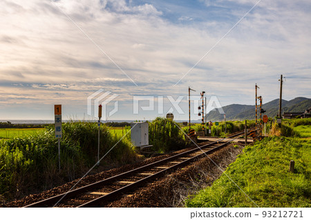 Scenery of Hongo railroad crossing and rice terraces on the San'in Main Line, Toyoura-cho, Shimonoseki City, Yamaguchi Prefecture 93212721
