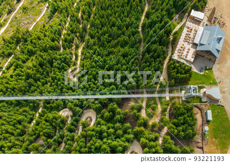 Top view of a Sky Bridge 721 in Dolni Morava in Czech Republic. The longest suspension footbridge in the world in the forest between hills. Top view of a Sky Bridge 721 in Dolni Morava in Czech Republic. The longest suspension footbridge in the world in the forest between hills. 93221193