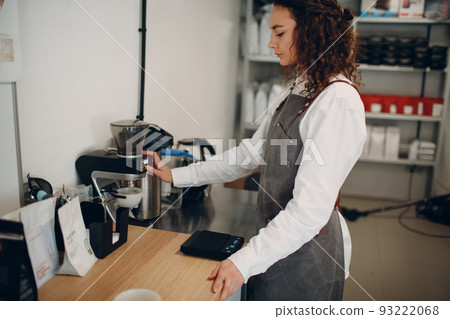 Cup Taster Girl Tasting Degustation Coffee Quality Test. Young woman barista with Coffee Mill Grinder. Cup Taster Girl Tasting Degustation Coffee Quality Test. Young woman barista with Coffee Mill Grinder. 93222068