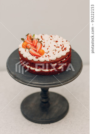 Pastry chef makes delicious red velvet cake. Cooking and decorating dessert. Pastry chef makes delicious red velvet cake. Cooking and decorating dessert. 93222153
