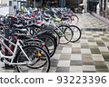 bikes parked on street in rainy weather 93223396