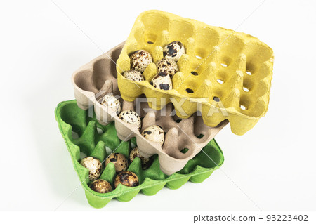 quail eggs in the package on white background 93223402