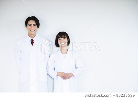 Doctor doctor man and woman smiling looking at camera white background 93225559