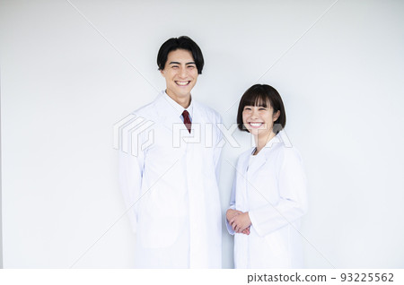 Doctor doctor man and woman smiling looking at camera white background Doctor doctor man and woman smiling looking at camera white background 93225562