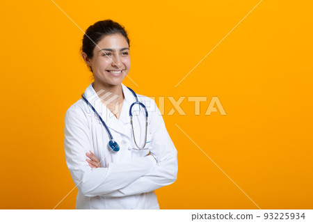 Portrait of indian doctor woman in white medical gown stethoscope isolated on yellow background. Portrait of indian doctor woman in white medical gown stethoscope isolated on yellow background. 93225934