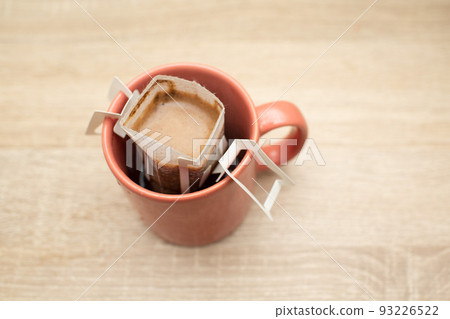 Coffee Drips pack in cup. Alternative brewing specialty coffee in paper filter bags. Coffee Drips pack in cup. Alternative brewing specialty coffee in paper filter bags. 93226522