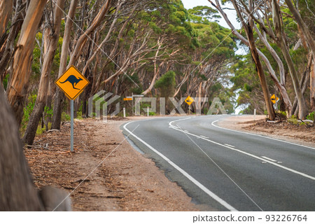 Kangaroo warning sign by the country road Kangaroo warning sign by the country road 93226764