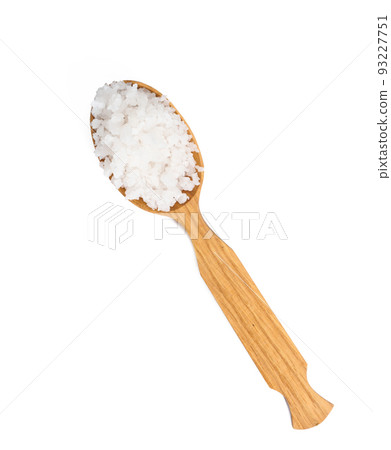 Large crystals of white sea salt in a brown wooden spoon Large crystals of white sea salt in a brown wooden spoon 93227751