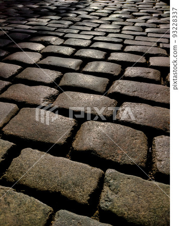 old pavement lined with stones old pavement lined with stones 93228337