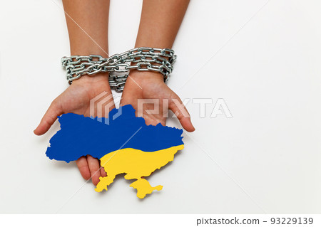 hands tied with a chain on a white background hands tied with a chain on a white background 93229139