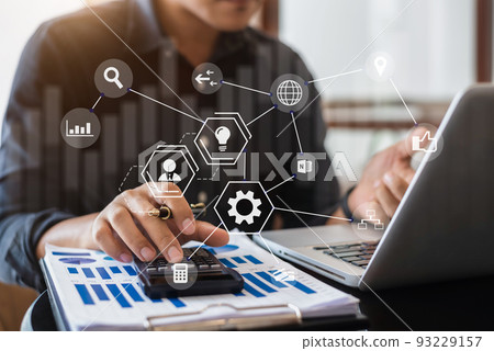 Businessman working with tablet and using a calculator to calculate the tax of static in office. Finance accounting conc Businessman working with tablet and using a calculator to calculate the tax of static in office. Finance accounting conc 93229157