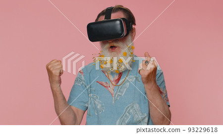 Man using virtual reality futuristic technology VR headset helmet to play simulation 3D video game 93229618
