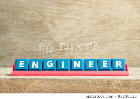 Tile letter on red rack in word engineer on wood background 93230116
