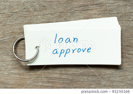 Flash card with handwriting word loan approve on wood background 93230166