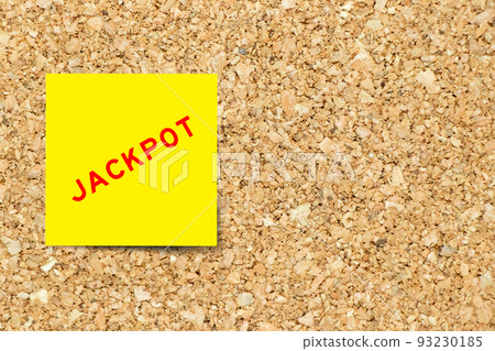 Yellow note paper with word jackpot on cork board background with copy space Yellow note paper with word jackpot on cork board background with copy space 93230185