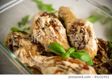 grilled chicken legs fried with spices in garlic sauce 93232452