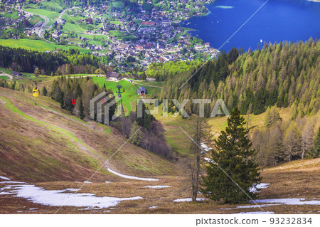 View of St.Gilgen village, Wolfgangsee lake and colorful Seilbahn cable car gondolas from Zwolferhorn mountain in Salzkammergut region, Austria 93232834