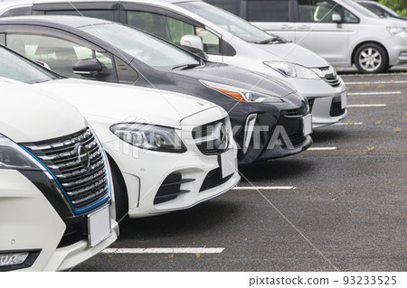 Cars lined up in a parking lot Cars lined up in a parking lot 93233525