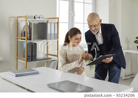 Happy client signs a contract agreement at the loan broker or insurance agent's office 93234206